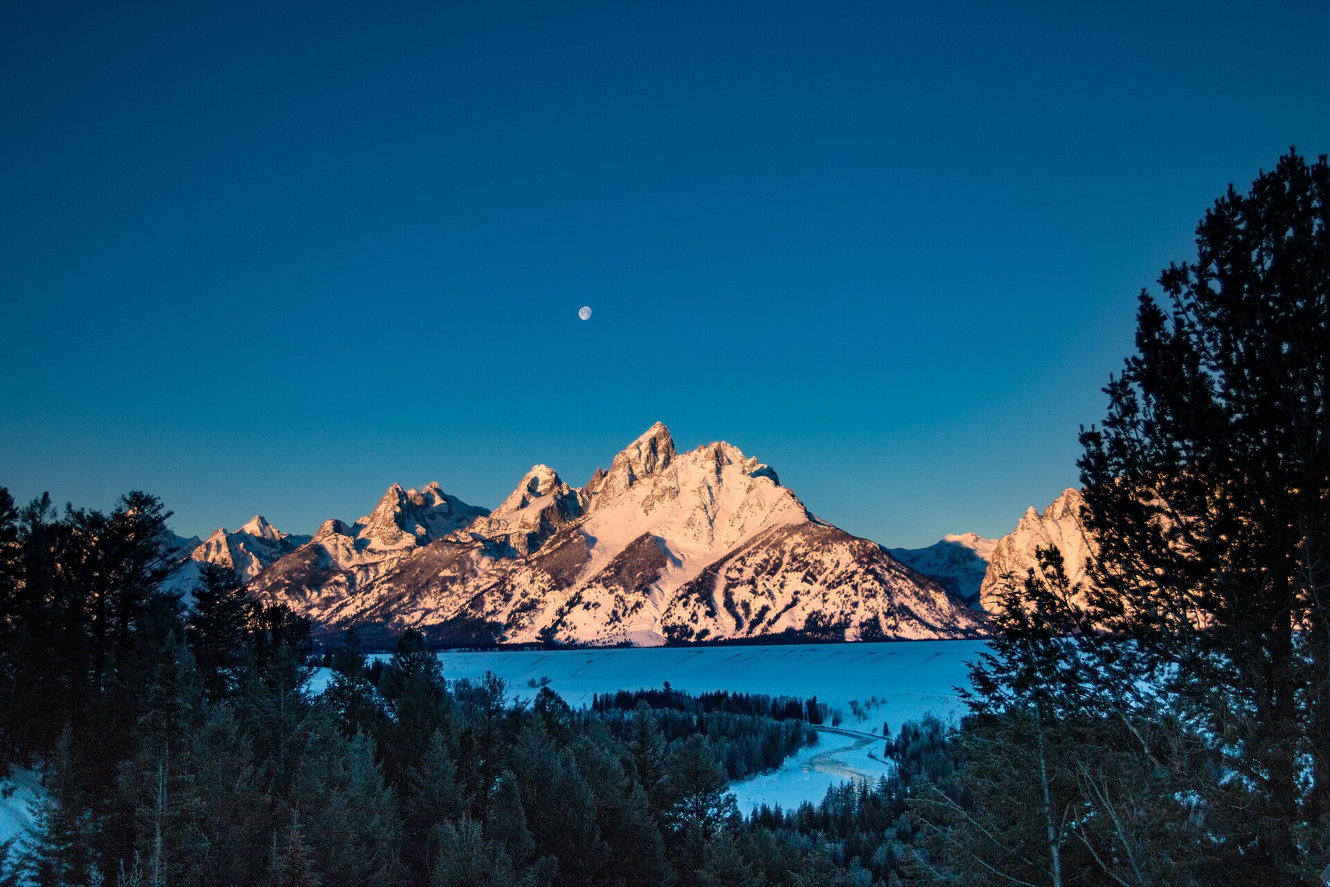 The Grand Teton range at sunrise above the Snake River, Jackson, Wyoming